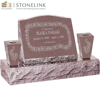 Granite slant headstone with vases