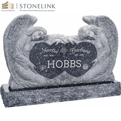 Kneeling angels embracing double heart granite headstone